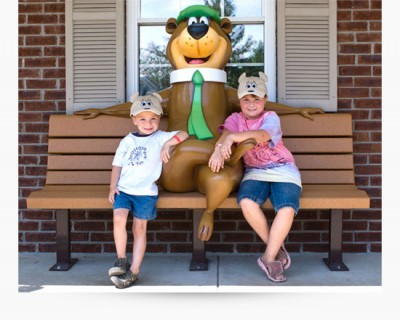 Yogi statue on a park bench